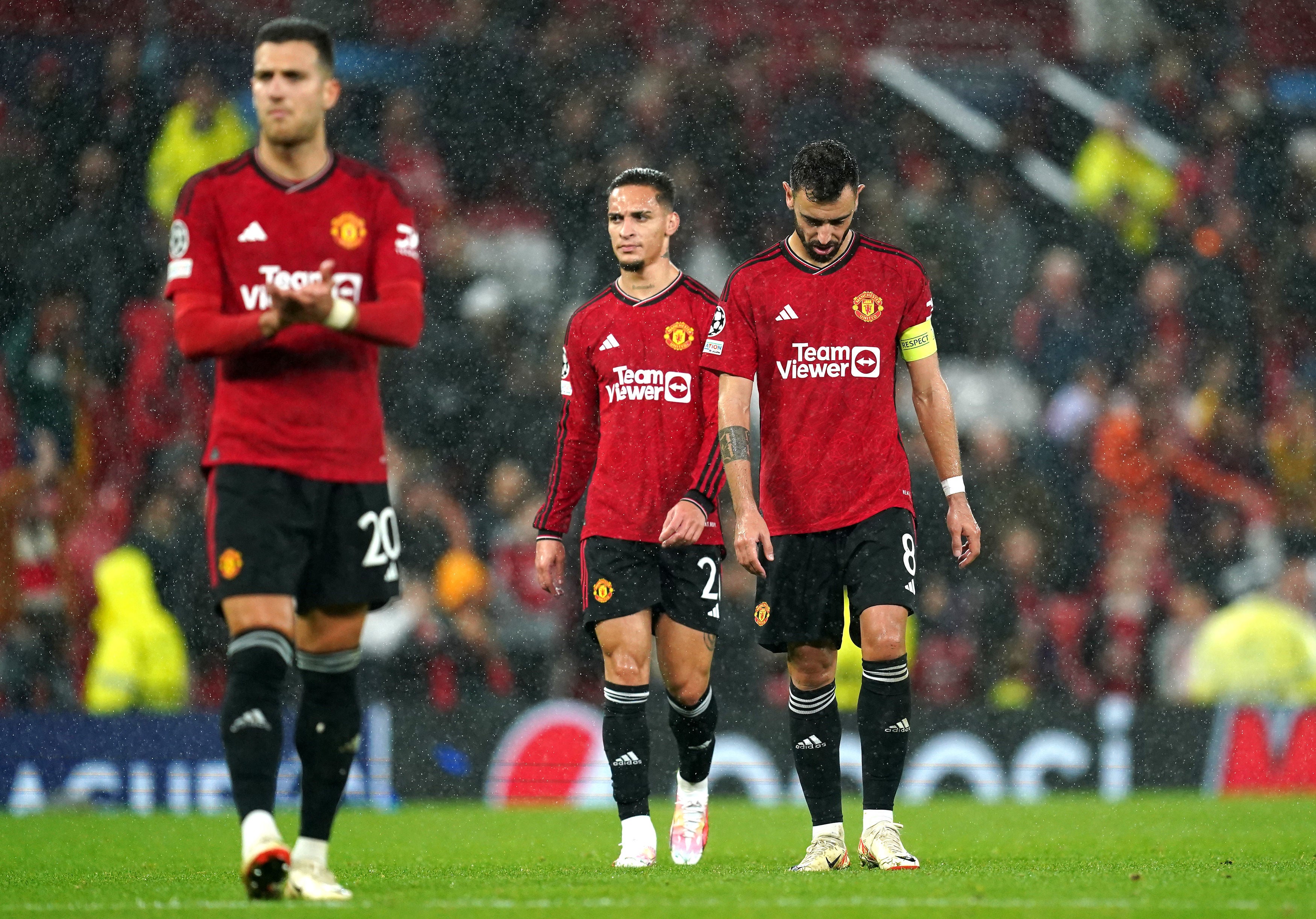 Manchester United’s Bruno Fernandes and Antony look dejected after the final whistle against Galatasaray