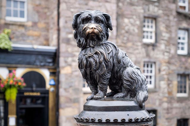 Greyfriars Bobby is commemorated with a statue near the church (Alamy/PA)