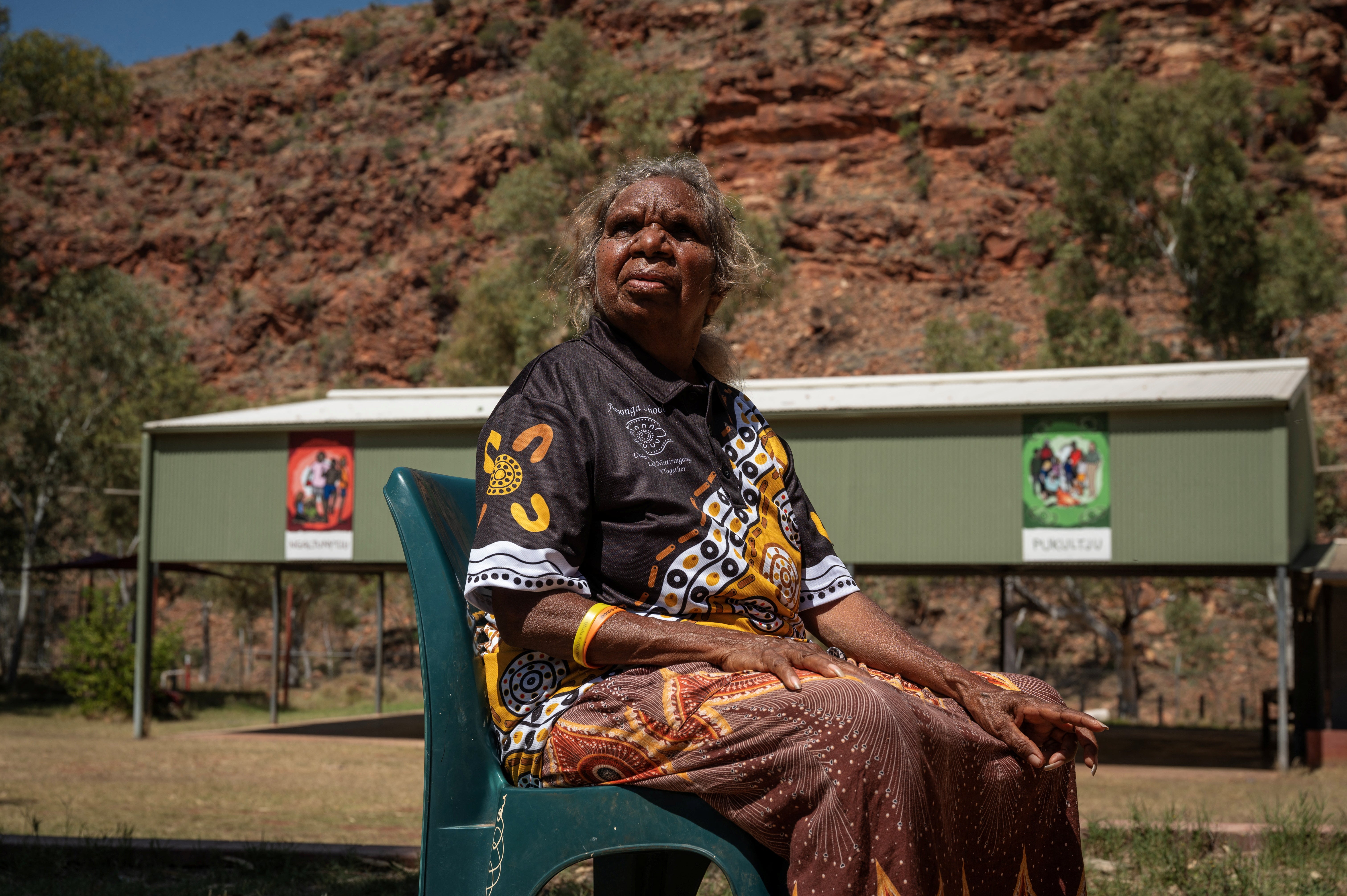 Teacher Tarna Andrews sits in the school grounds in Areyonga