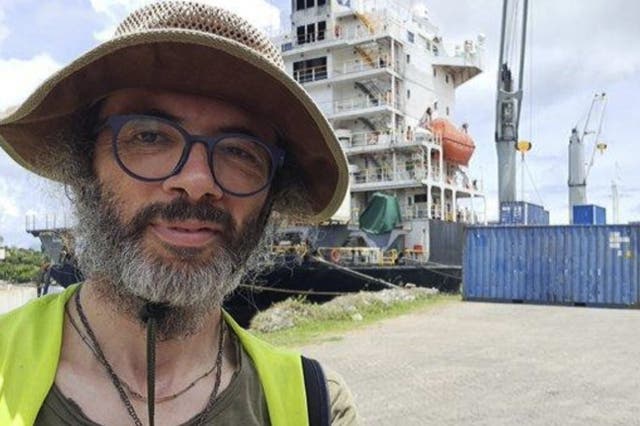<p>Dr Gianluca Grimalda pictured on his 9,300-mile overland journey to Papua New Guinea. The senior climate researcher at the Kiel Institute in Germany, lost his job this week over his refusal to fly</p>