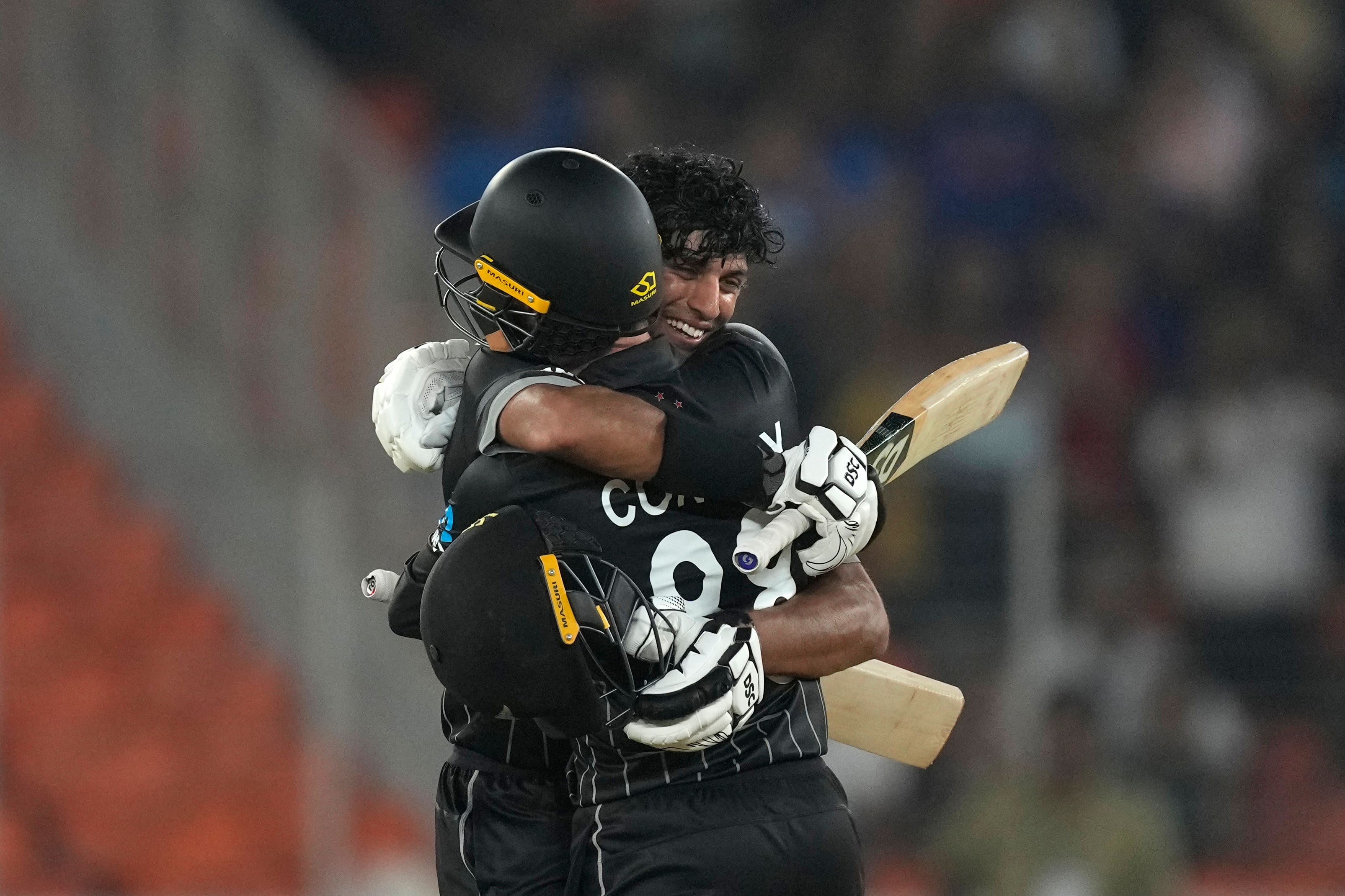 Devon Conway (152no) and Rachin Ravindra (123no) celebrate a crushing victory for the Black Caps after their stand of 273 in Ahmedabad