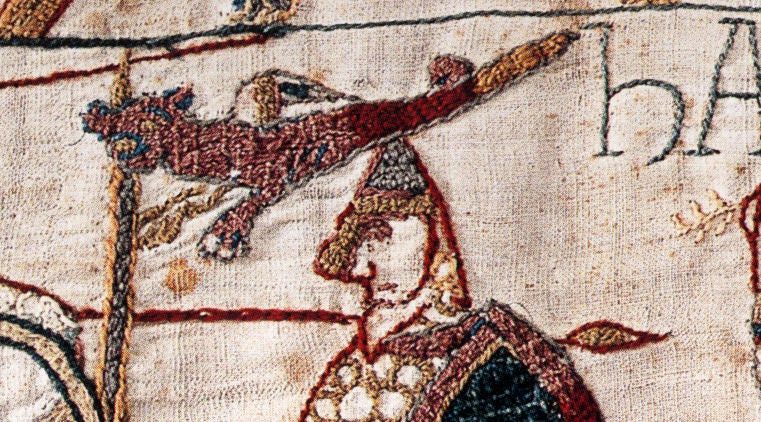 The wyvern (a two-legged dragon) was a symbol of the Anglo-Saxon Kings of Wessex/England - and features on the giant silver brooch. This image, from the Bayeux Tapestry, shows the last ruler of Wessex's wyvern banner at the Battle of Hastings.