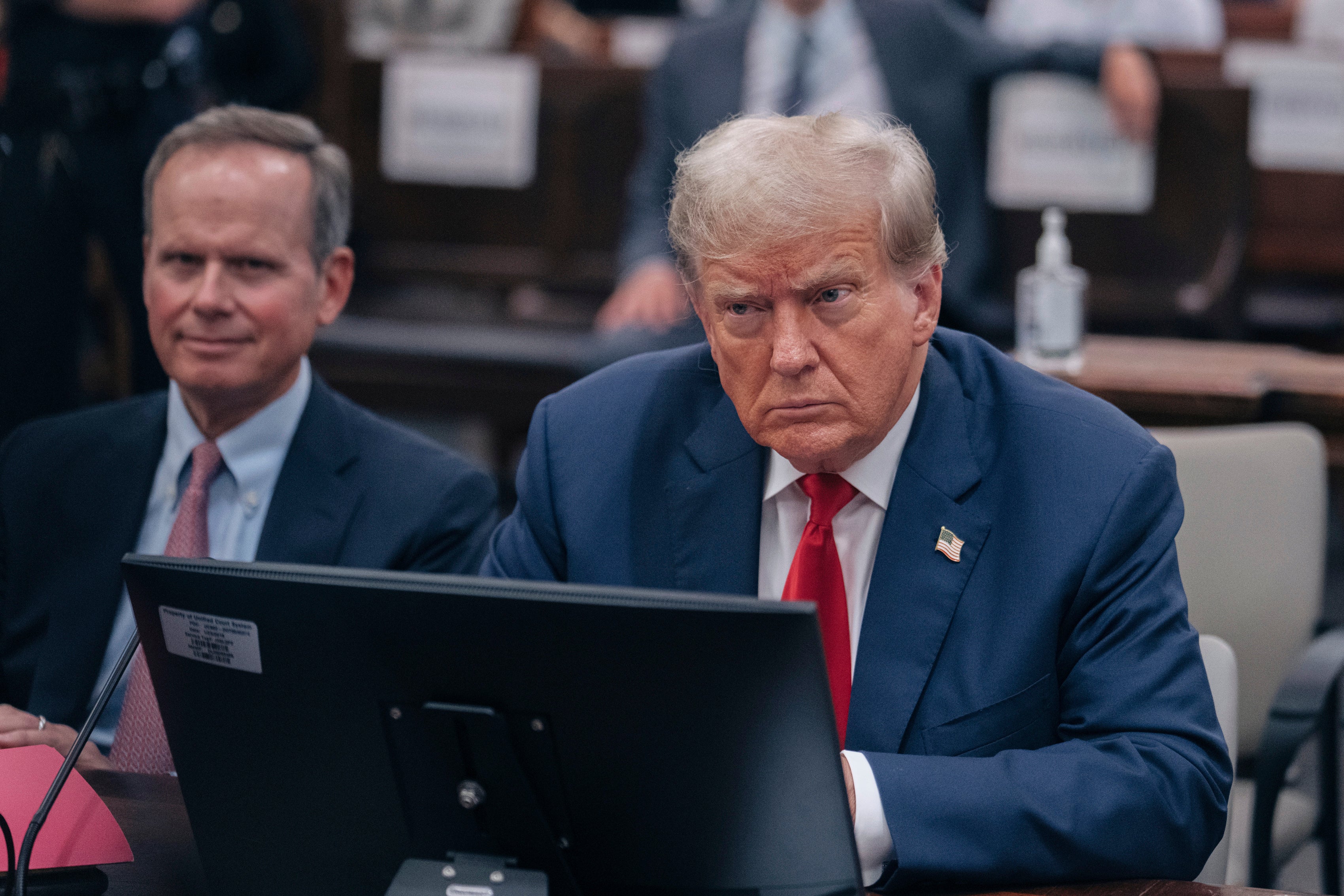 Former US President Donald Trump sits inside the courtroom at his civil fraud trial