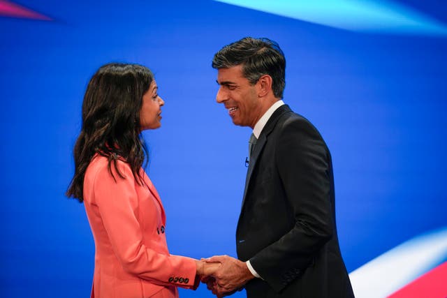 <p>Akshata Murty embraces Rishi Sunak on stage at the final day of the Conservative Party Conference in Manchester</p>