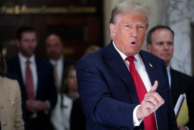 <p>Former President Donald Trump speaks to reporters as he leaves the courtroom during a lunch break in his civil business fraud trial, Oct. 4, 2023, in New York</p>