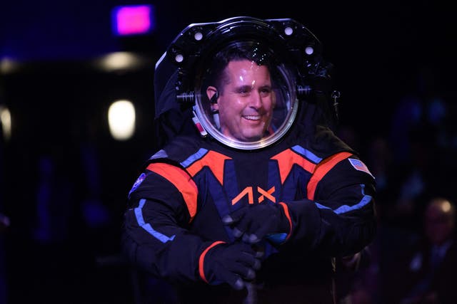 <p>Chief Engineer Jim Stein wears the new spacesuit during the Axiom Space Artemis III Lunar Spacesuit event at Space Center Houston in Houston, Texas on 15 March 2023</p>