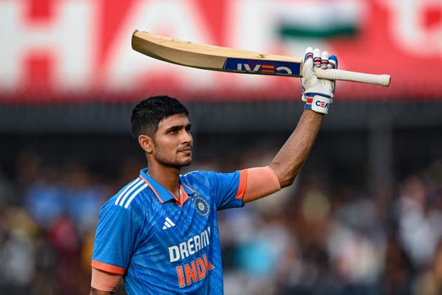 <p>Shubman Gill celebrates after scoring a century (100 runs) during the second one-day international (ODI) cricket match between India and Australia at the Holkar Cricket Stadium in Indore on 24 September</p>