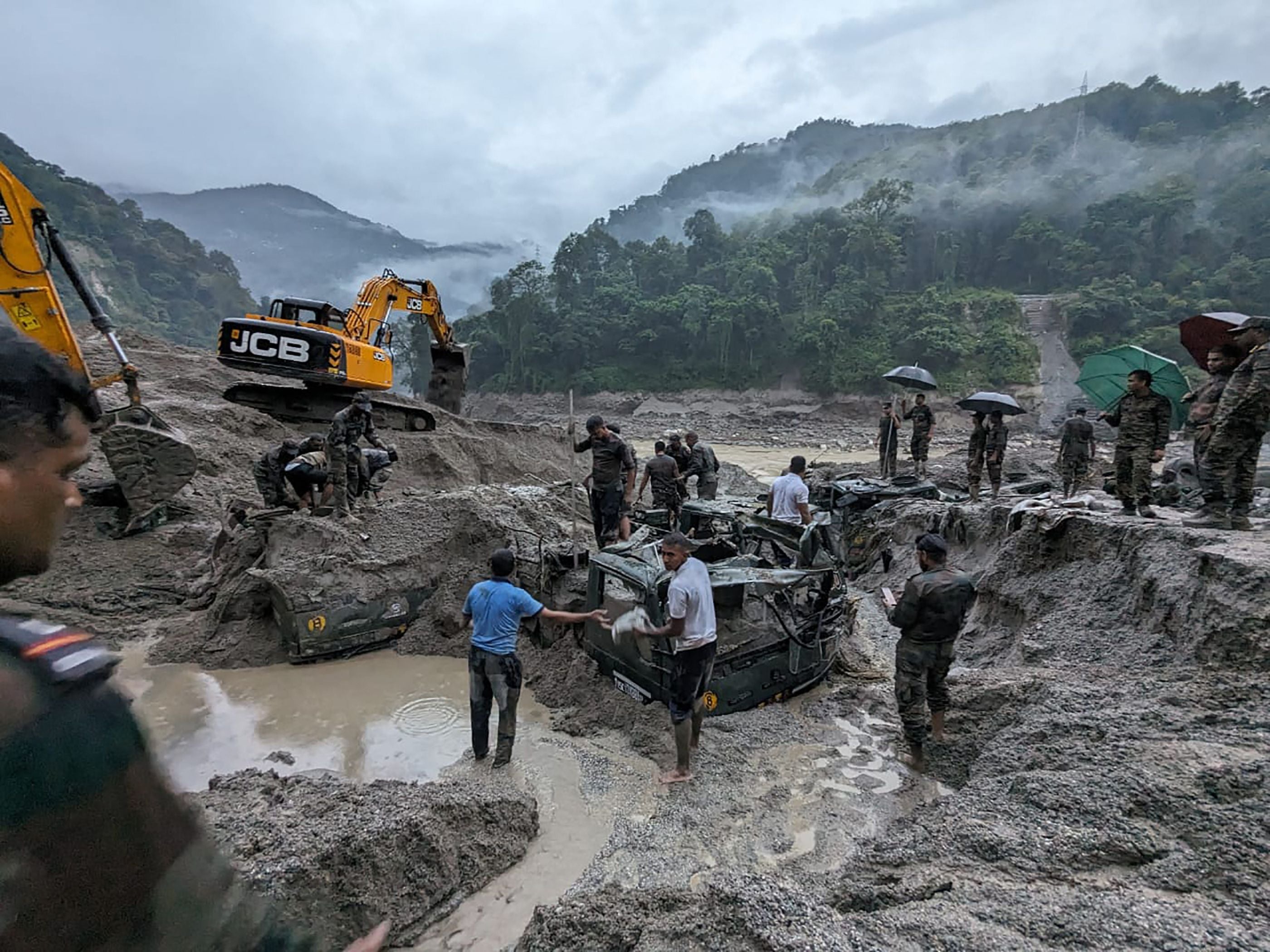 Indian army personnel conduct a search operation for the missing soldiers in north Sikkim