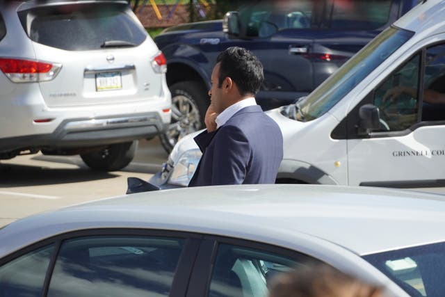 <p>Republican presidential candidate Vivek Ramaswamy speaks on the phone while viewing the damage to one of his campaign vehicle, Thursday, Oct. 5, 2023, in Grinnell, Iowa</p>
