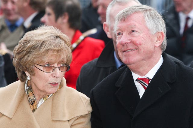 <p>Lady Cathy Ferguson alongside husband Sir Alex at his statue unveiling outside Old Trafford in 2012 </p>