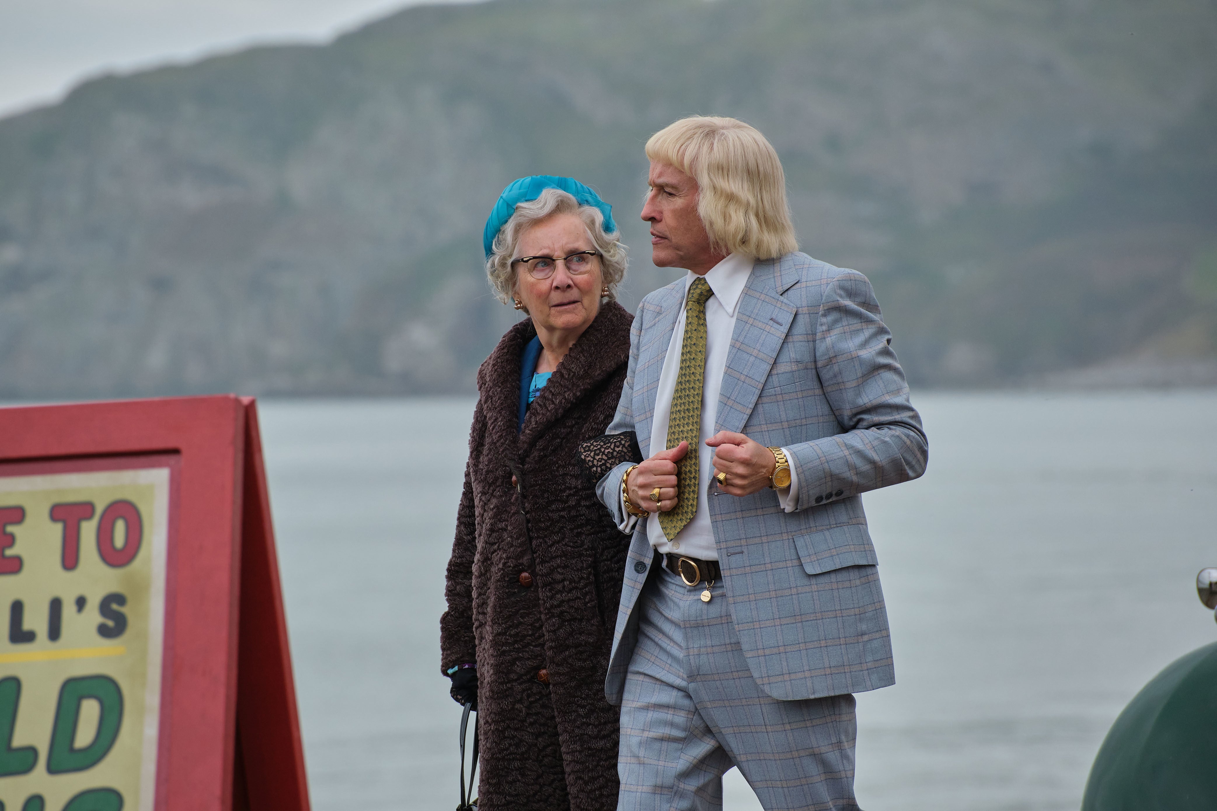 Gemma Jones and Steve Coogan as Agnes and Jimmy Savile taking a walk in Scarborough