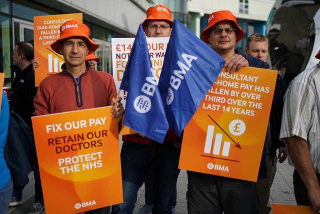 Junior doctors and medical consultant members of the British Medical Association on the picket line on Monday (Jacob King/PA)