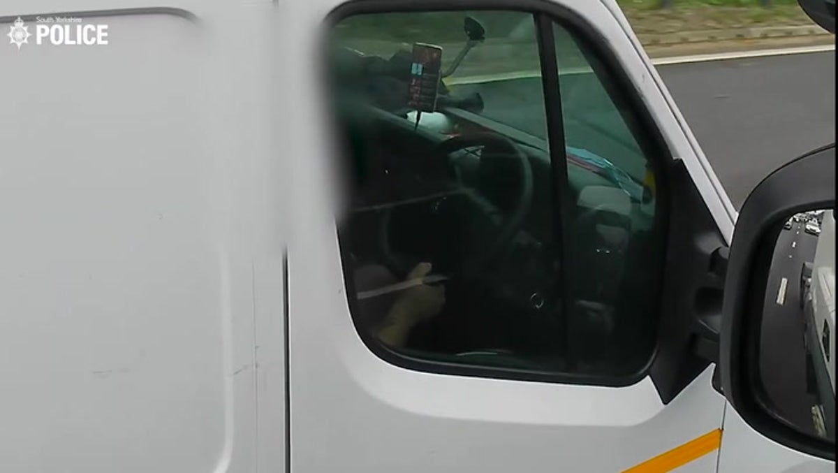 Van driver watches favourite TV show while speeding down major motorway