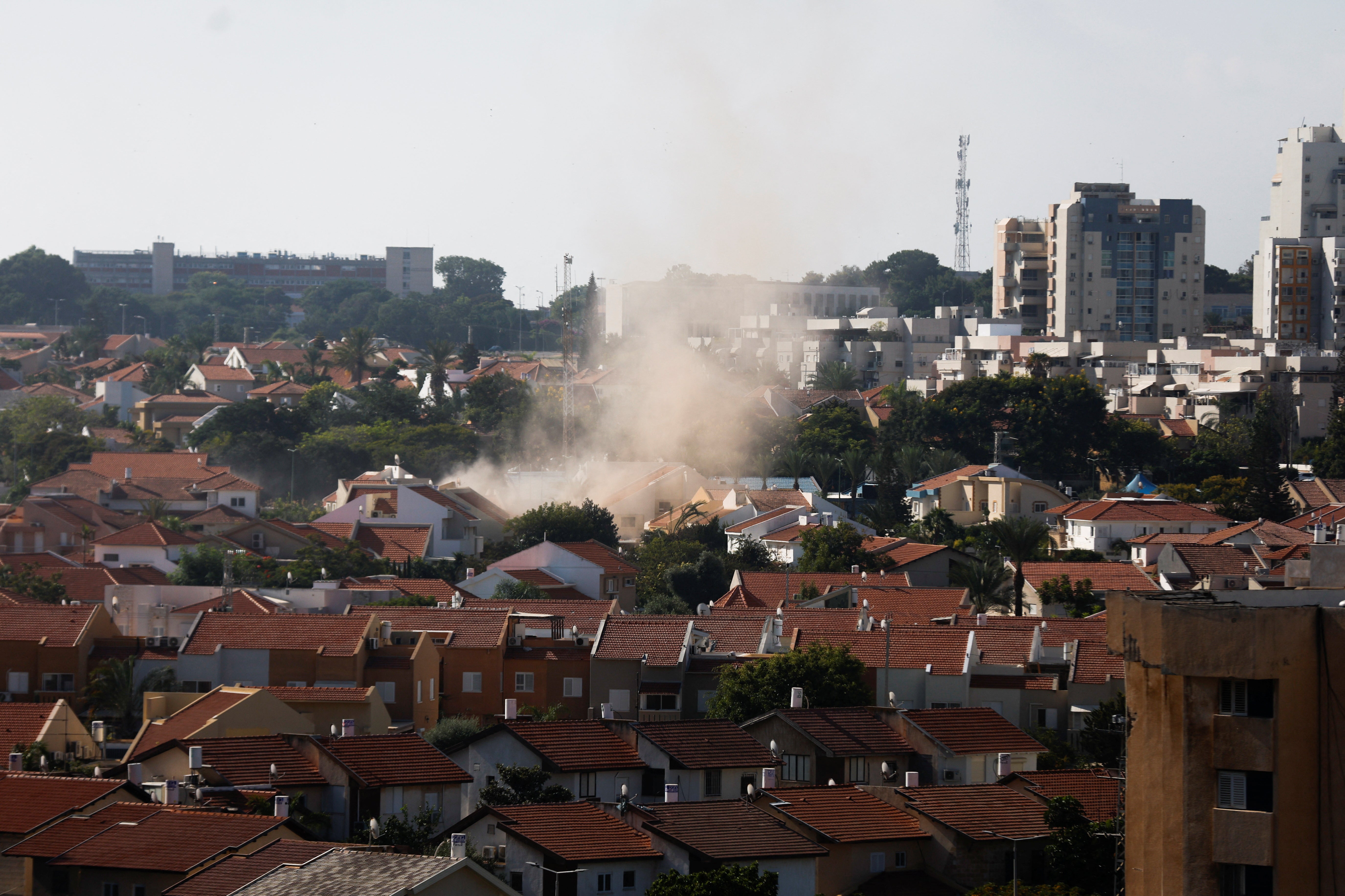 Smoke rose in Ashkelon in the aftermath of rocket barrages that were launched from Gaza