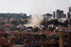 Israel rocket attack sends smoke billowing into morning sky as aftermath captured