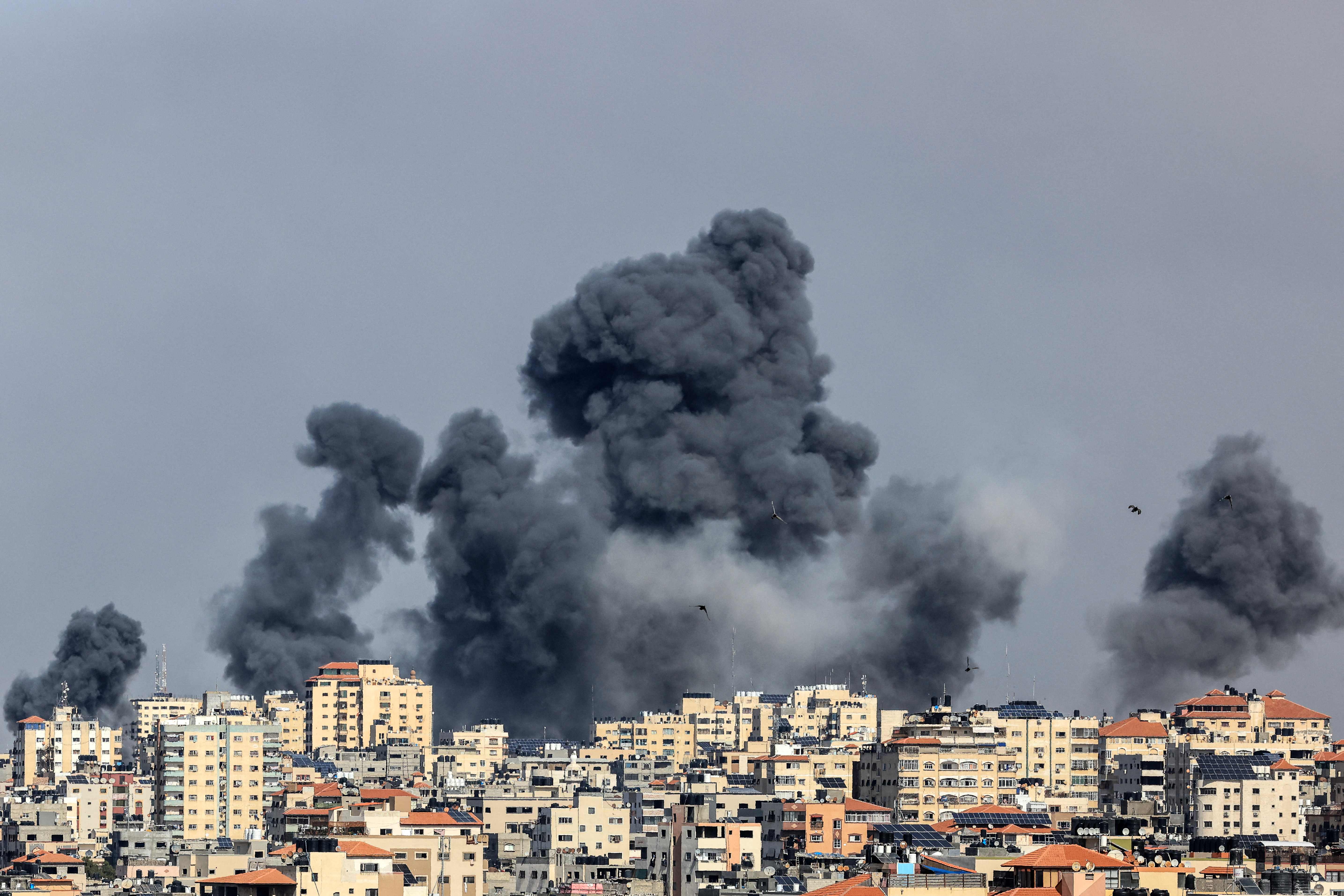 Smoke rises over Gaza City on October 7, 2023 during Israeli air strike