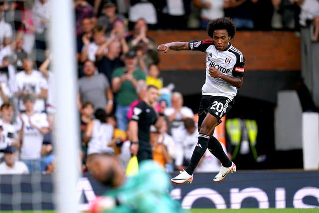 Fulham’s Willian celebrates scoring his side’s third goal (John Walton, PA)