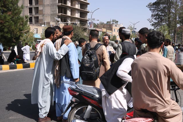 <p>Residents come out onto a street after an earthquake rocked the city of Herat</p>