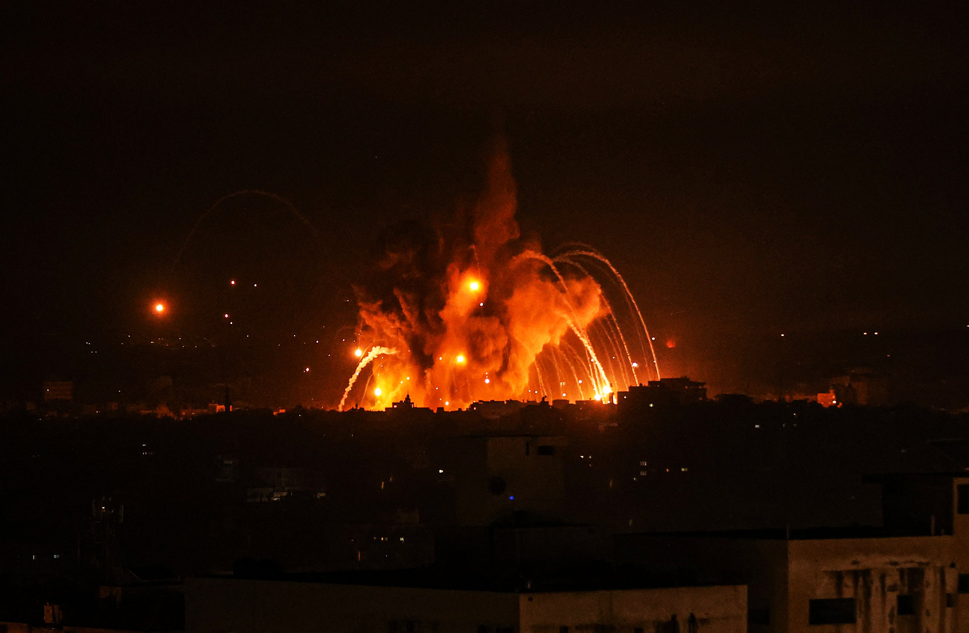 Smoke and flames rise after Israeli force airstrikes in Gaza