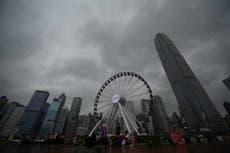 Hong Kong suspends flights and shuts schools as Typhoon Koinu approaches