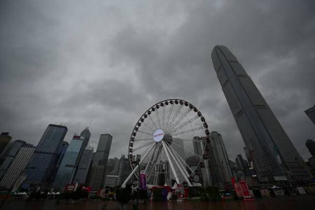 <p>Heavy rain clouds are seen over Central district as Hong Kong hoisted typhoon signal no 8 around noon</p>