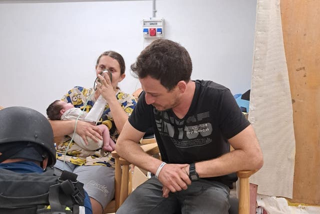 <p>Aimee Labban, her husband Uriel, and newborn Kai, receive treatment after being rescued by the IDF.  </p>