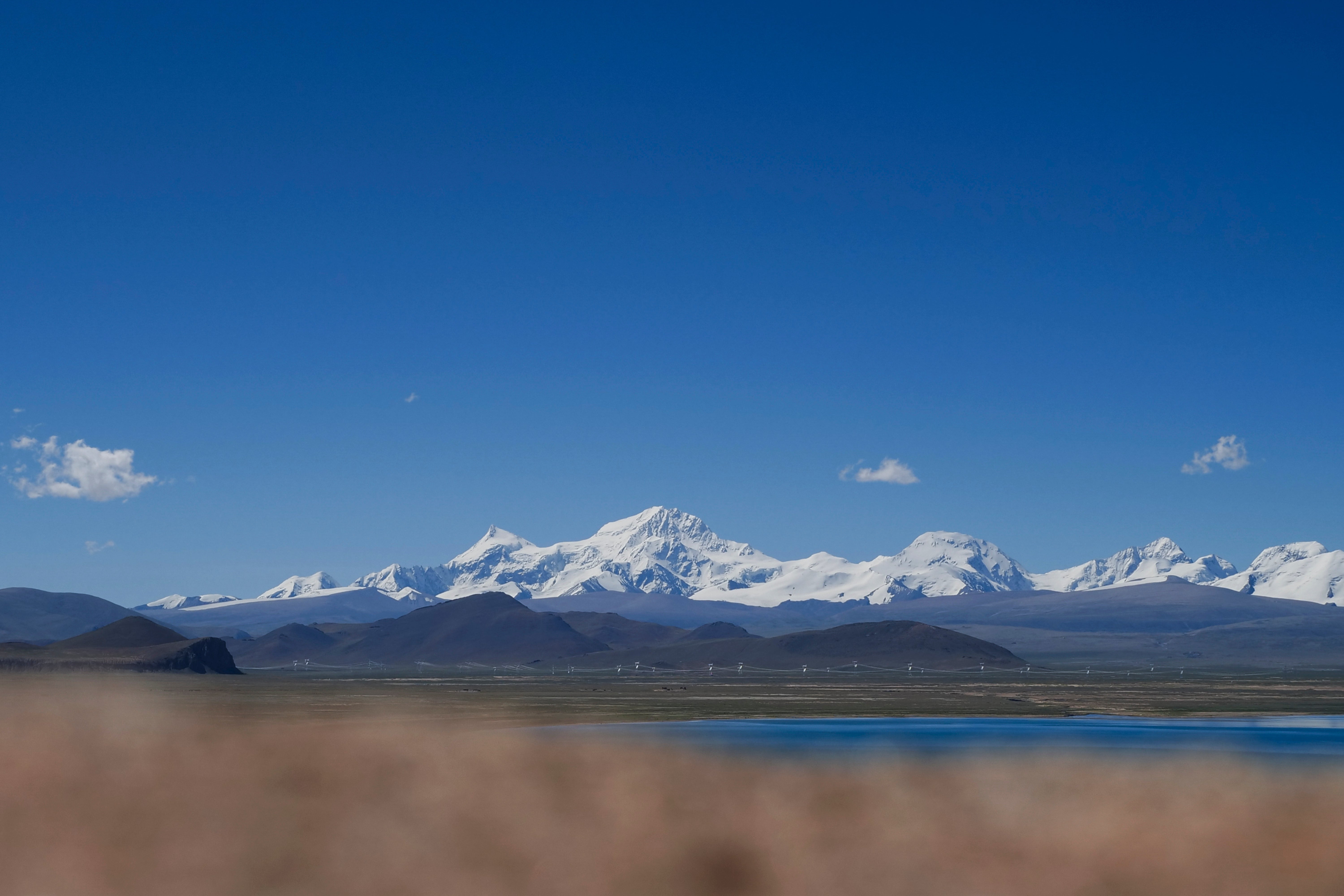 In this photo released by Xinhua News Agency, Mount Shishapangma is seen from Baiku Lake in Xigaze, southwest China’s Tibet Autonomous Region on 2 September 2023