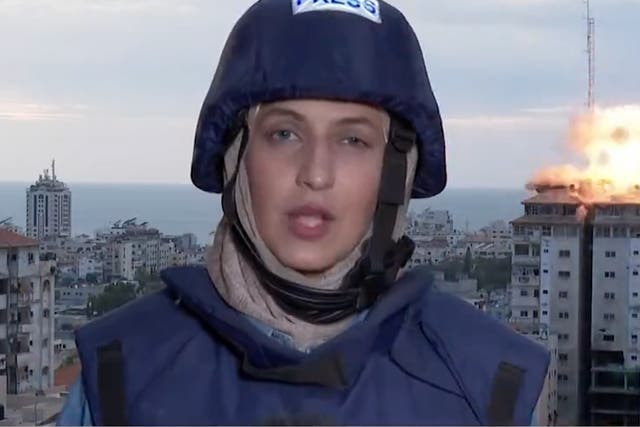 <p>Reporter runs for cover as Gaza tower block hit by airstrike on live TV</p>