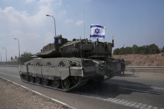 An Israeli tank heads south near Sderot (Ohad Zwigenberg/AP/PA)