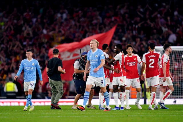 Arsenal players celebrate at the end of the win against Manchester City (John Walton/PA)