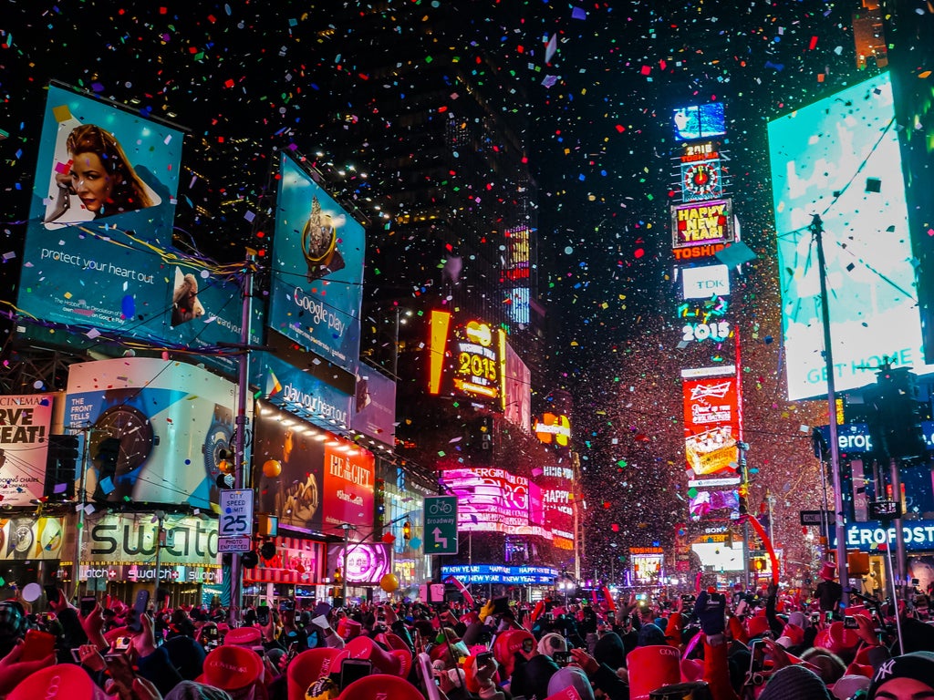 The Times Square ball drops in front of thousands at midnight on 31 December