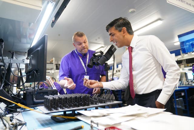 Prime Minister Rishi Sunak during a visit to the Currys Repair Centre, in Coddington, Newark, Nottinghamshire (PA)
