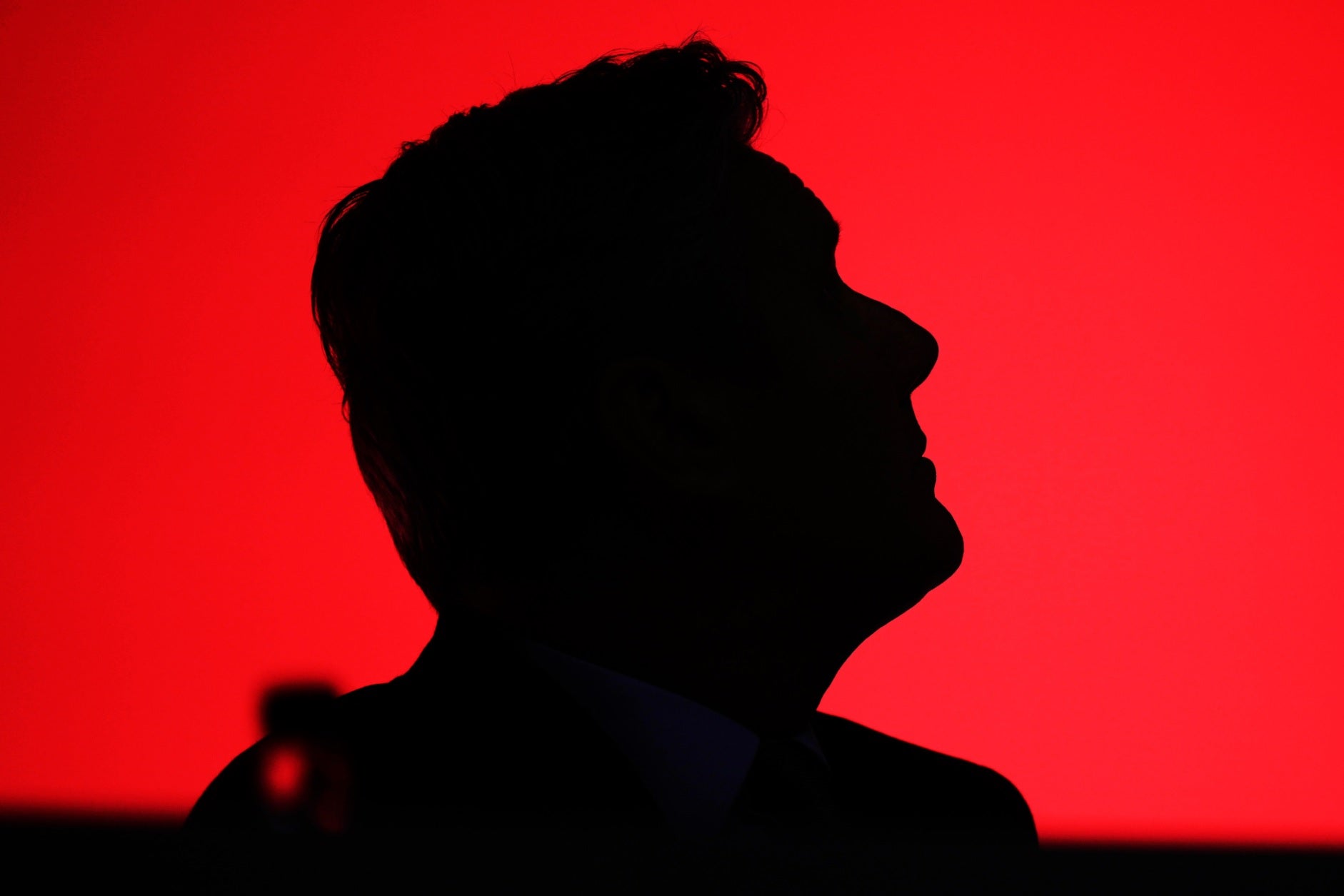 Labour Party leader Sir Keir Starmer is silhouetted as he watches a video screen on day one of the annual Labour party conference on 8 October, 2023, in Liverpool, England