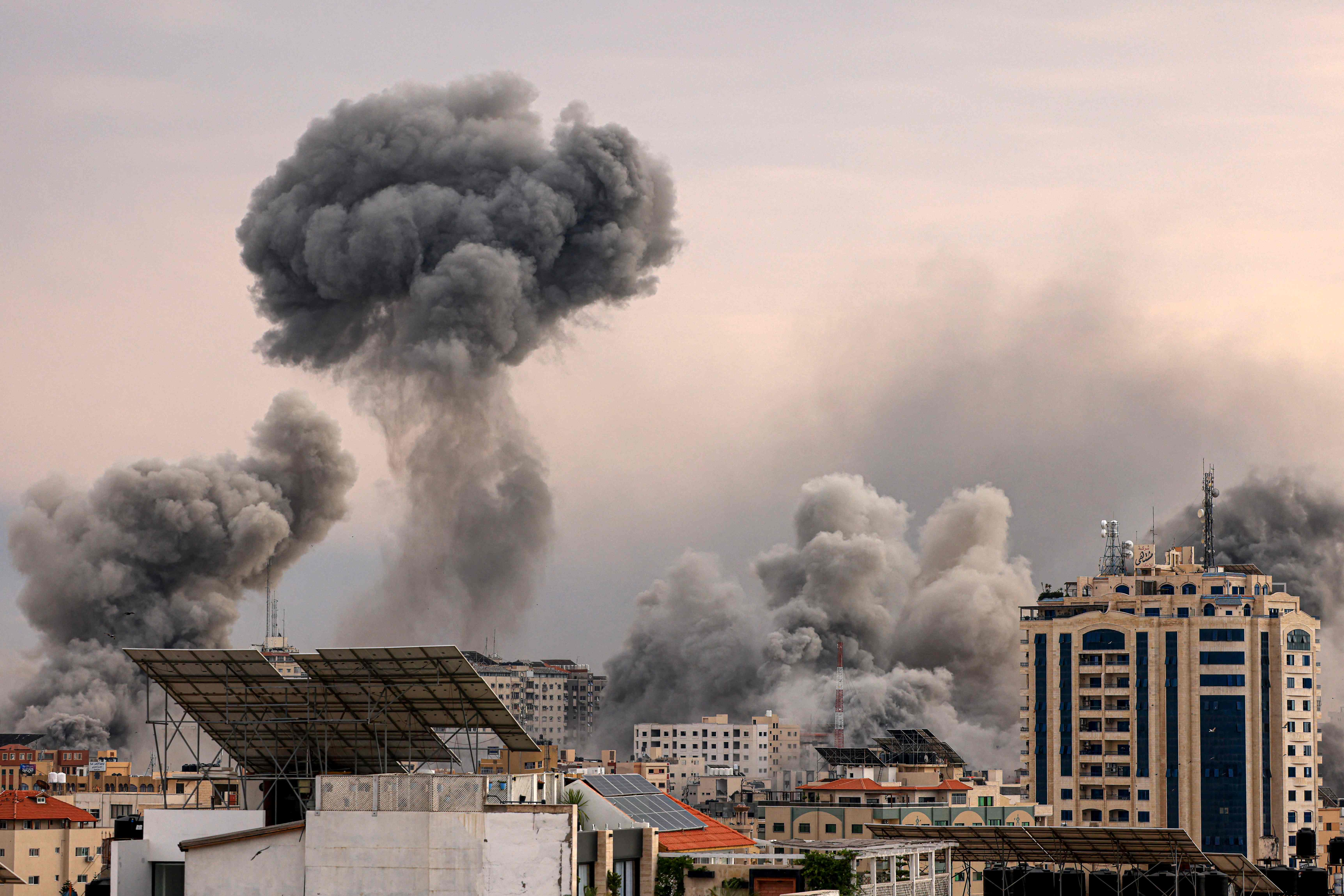 A plume of smoke rises in the sky of Gaza City during an Israeli airstrike