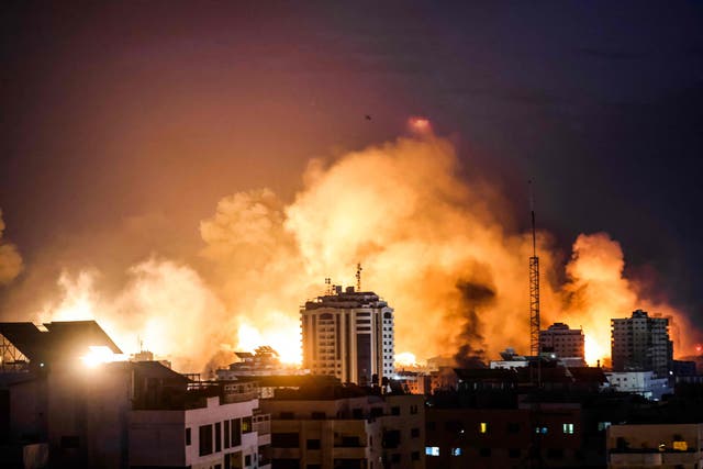 <p>A fireball erupts during Israeli bombardment of Gaza City</p>