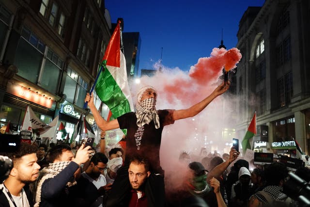 People take part in a Palestine Solidarity Campaign demonstration near the Israeli Embassy (Jordan Pettitt/PA)