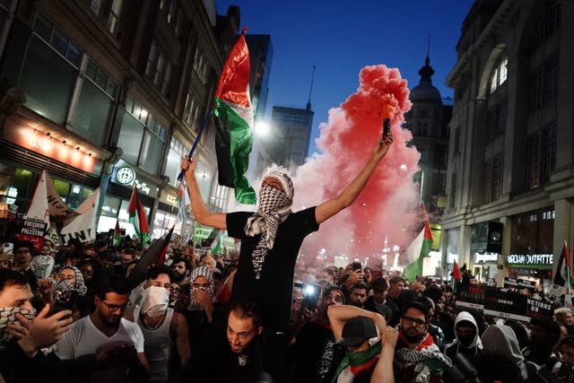 <p>Pro-Palestine supporters gather near the Israeli embassy in London following the country’s surprise invasion by Hamas, which killed hundreds</p>