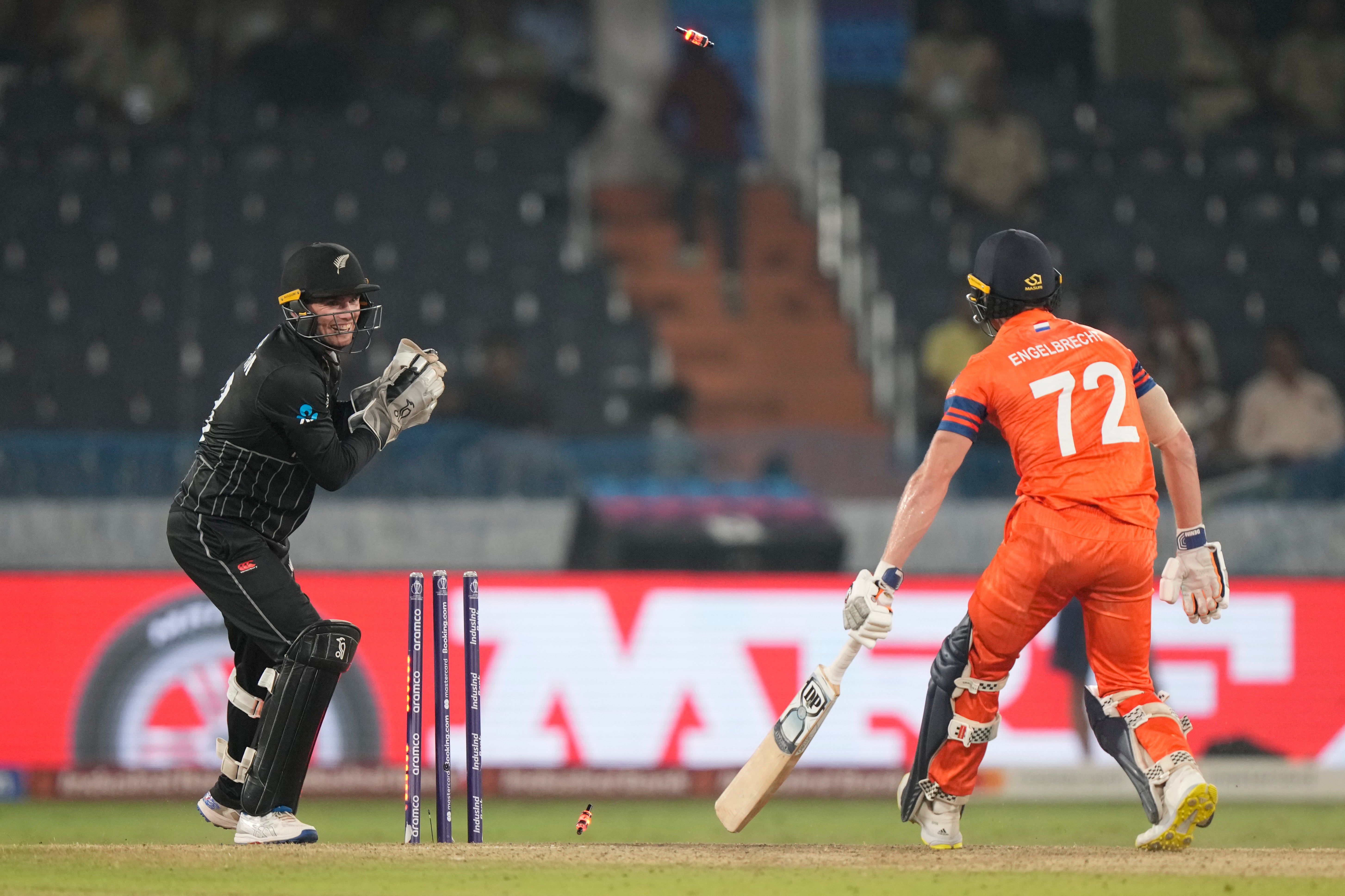 New Zealand’s wicketkeeper Tom Latham dislodges the bails to stump out Netherlands’ Sybrand Engelbrecht, which was deemed not out by the third umpire, during the ICC Men’s Cricket World Cup match between New Zealand and Netherlands in Hyderabad