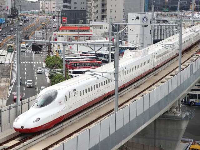 <p>Representative image: A ‘shinkansen’, or bullet train, passes over traffic on the streets below in Nagasaki on Japan’s Kyushu island on 23 September 2022</p>