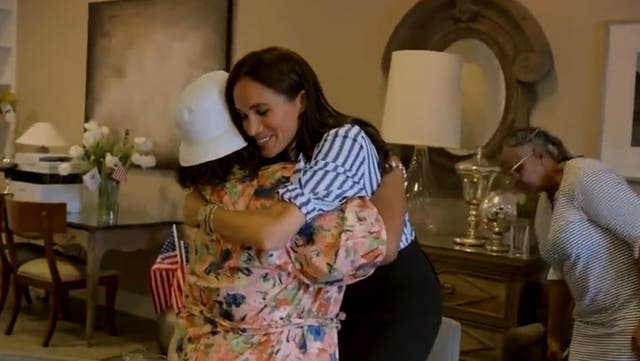<p>Meghan Markle hugs members of military families during secret veterans visit.</p>