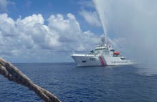 Chinese coast guard claims to have chased away Philippine navy ship from South China Sea shoal