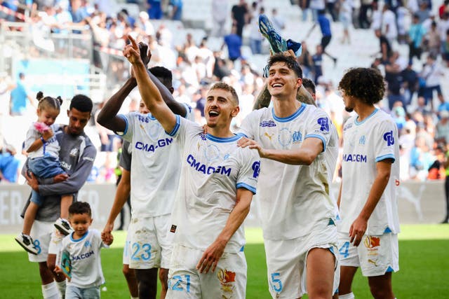 <p>Marseille’s Valentin Rongier and  Leonardo Balerdi celebrate victory over Le Havre</p>