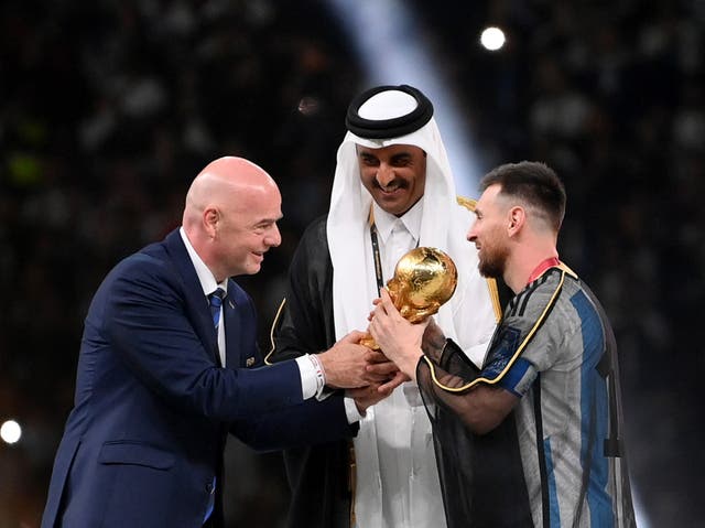 <p>Lionel Messi of Argentina is awarded the World Cup by Fifa president Gianni Infantino</p>