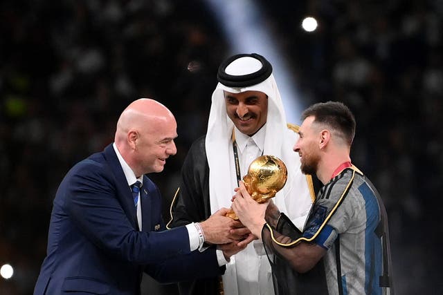 <p>Lionel Messi of Argentina is awarded the World Cup by Fifa president Gianni Infantino</p>