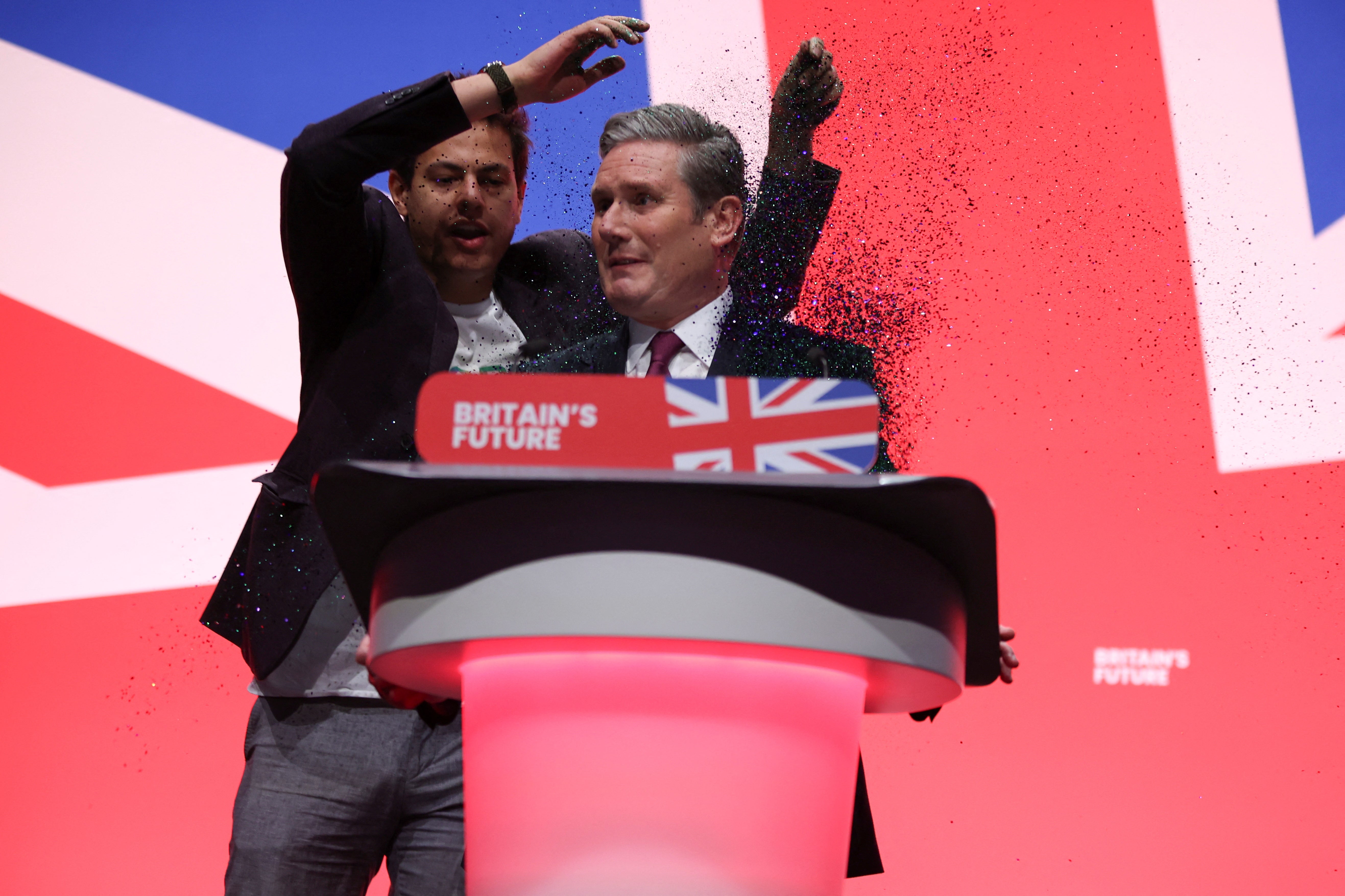 Sir Keir Starmer was doused in glitter at the start of his keynote speech