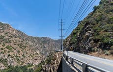 Man dies after car plunges off cliff in Malibu after colliding with two poles