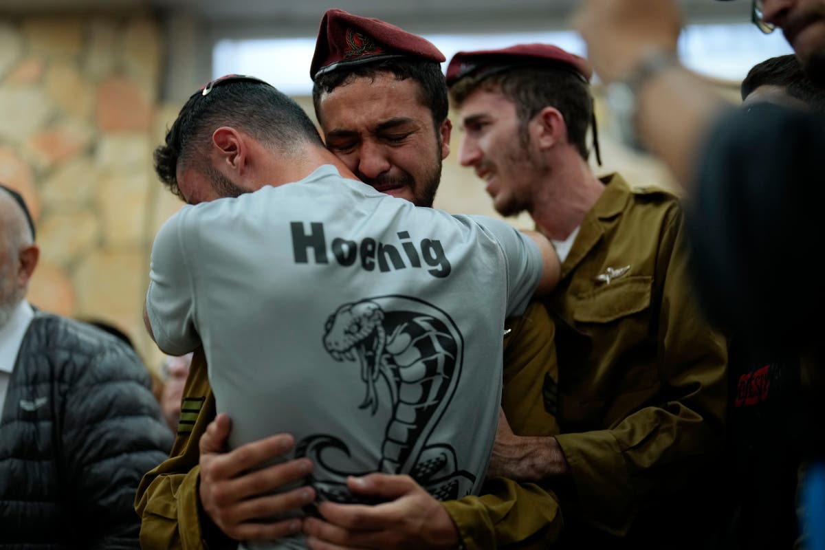 AP PHOTOS: Soldiers mobilize, mourners bury the dead as battles rage in Israeli-Palestinian war