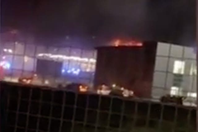 <p>A fire has ripped through a car park at Luton Airport </p>