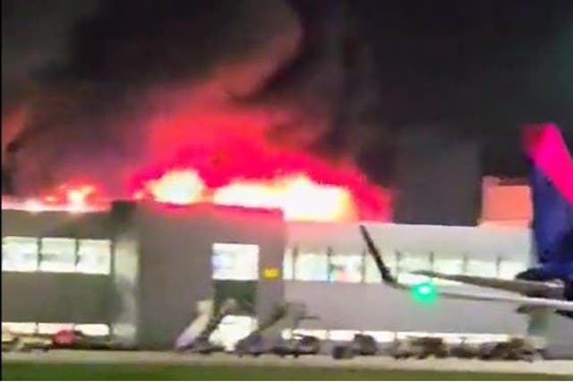 Screengrab taken with permission from video posted on Twitter by @ahmad_bobak of a fire at a car park at Luton Airport. All flights at the airport have been suspended. Issue date: Tuesday October 10, 2023 (Ahmad Hassan Bobak/Supplied)