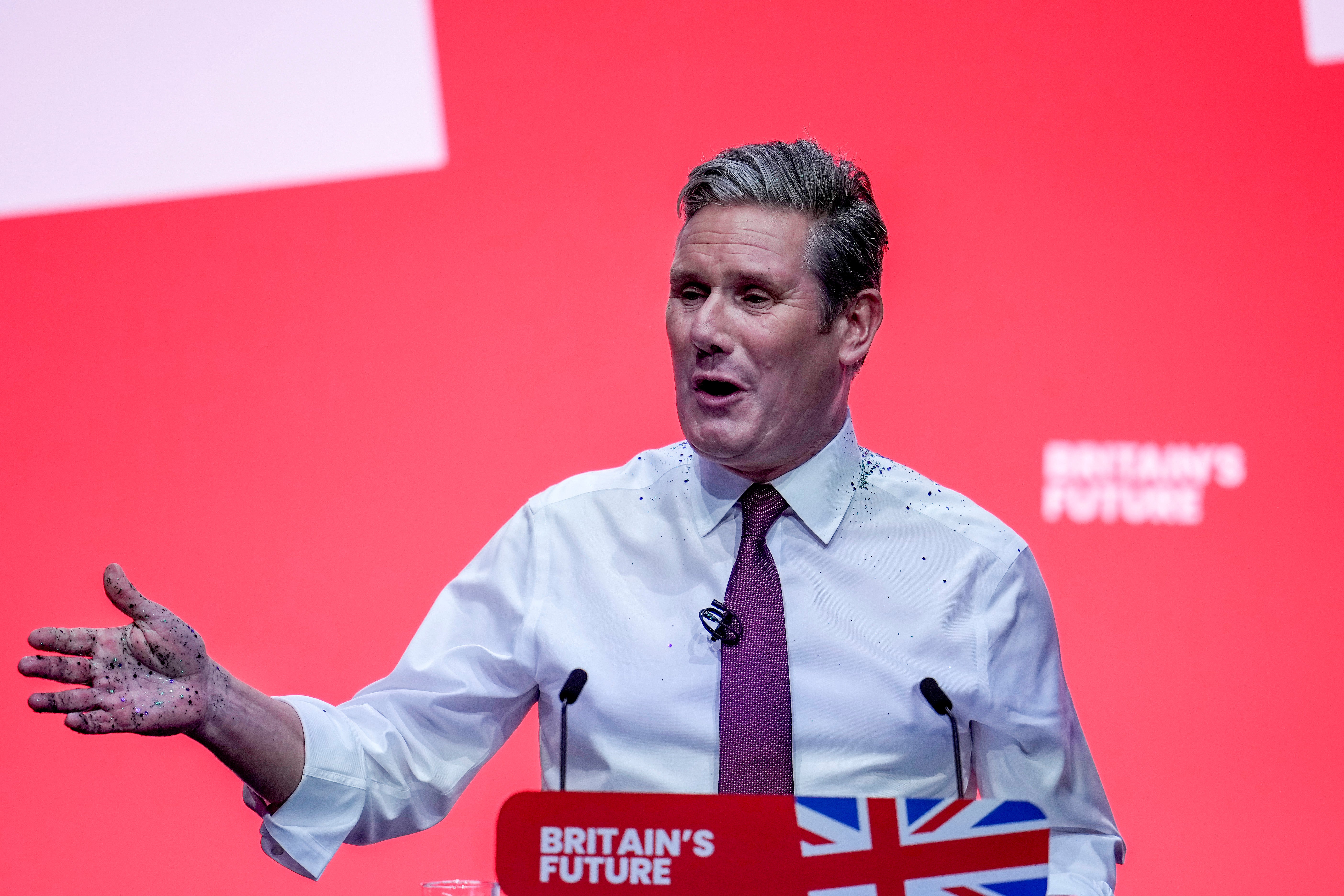 Labour party leader, Sir Keir Starmer delivers the leader’s speech, covered in glitter after a protestor stormed the stage on the third day of the Labour Party conference on 10 October 2023 in Liverpool, England
